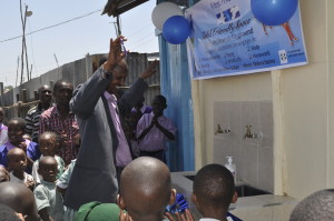 The chief of the district officially opens the washrooms